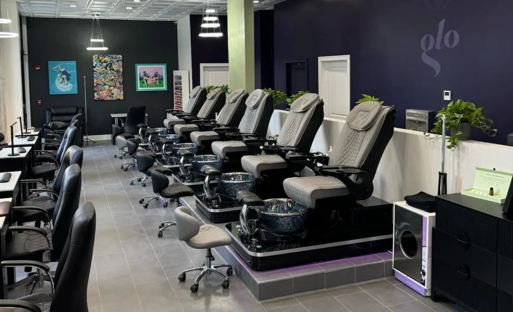 Home 7 a room with a lot of chairs and a sink - a nail salon